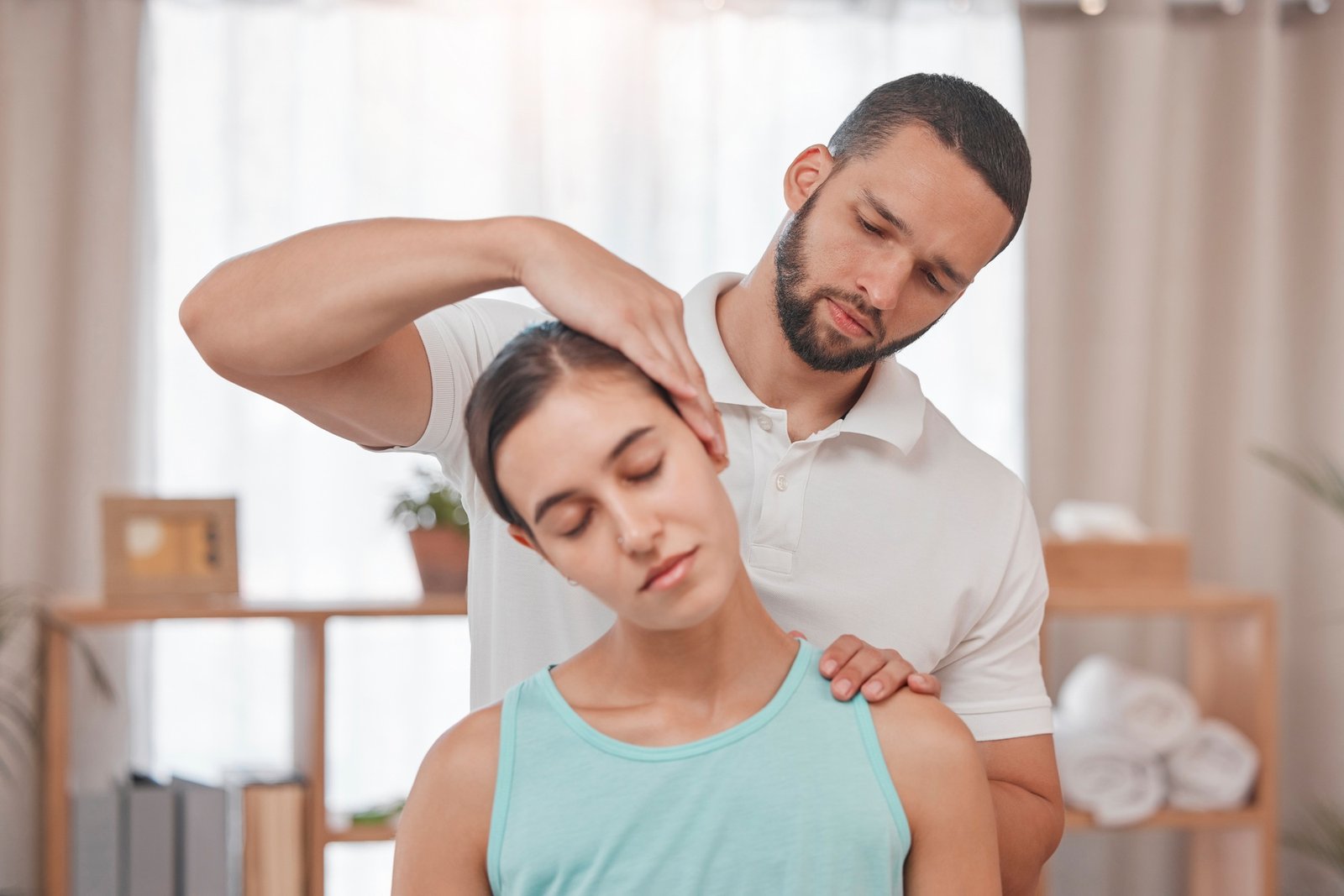 Physiotherapy, neck injury and woman in a consultation room with physiotherapist man for spine, bac